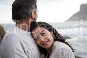 Couple embracing each other on beach