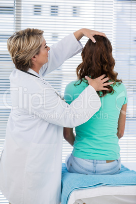 Doctor examining a patient's head