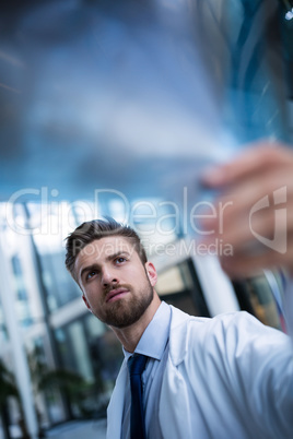 Doctor examining X-ray report