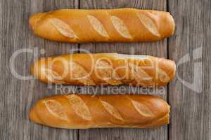 Baguettes on wooden background