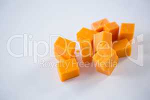 Cheese cubes on white background