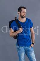 Man in blue t-shirt with backpack