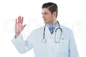 Male doctor touching an digital screen