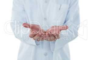 Male doctor gesturing against white background