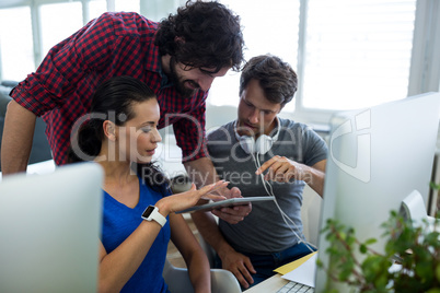 Team of graphic designers working at desk