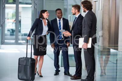 Businesswoman talking with colleagues