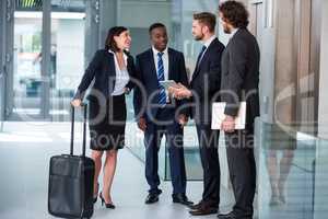 Businesswoman talking with colleagues