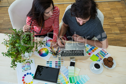 Graphic designers working at desk