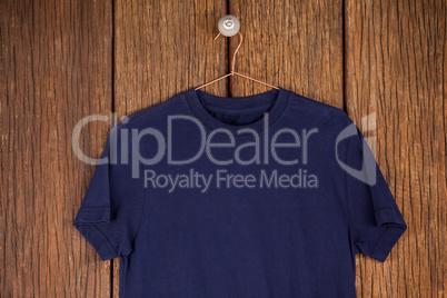 Navy blue t-shirt on hanger