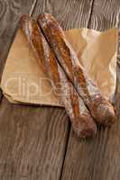 Baguettes on wooden background