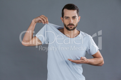 Portrait of man posing in grey t-shirt