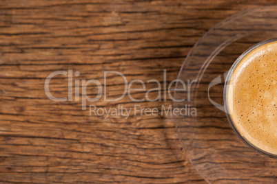 Cup of coffee on wooden table