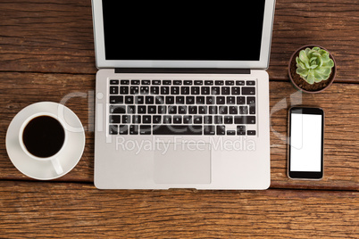 Laptop and smartphone with cup of coffee