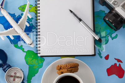 Holiday and tourism conceptual image with travel accessories and cup of coffee