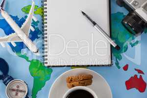 Holiday and tourism conceptual image with travel accessories and cup of coffee