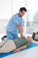 Doctor performing resuscitation on patient