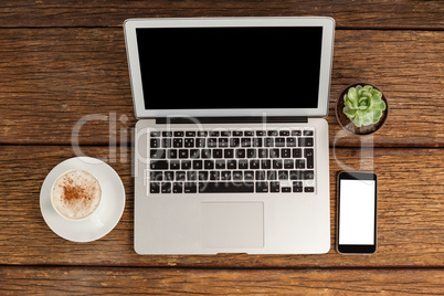 Digital tablet, laptop and smartphone with cup of coffee