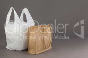 Beige fabric bag and white plastic bag