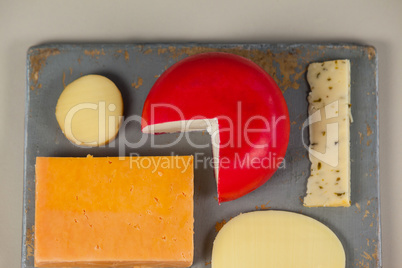 Variety of cheese on chopping board