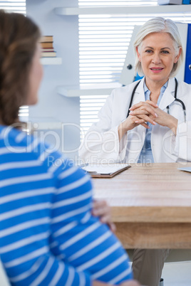 Pregnant patient consulting a doctor