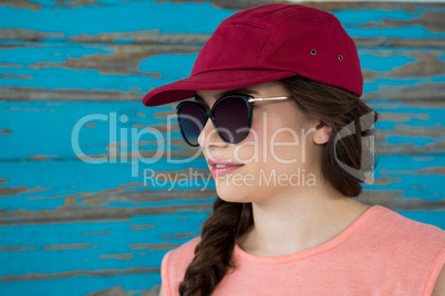 Woman in red cap and sunglasses