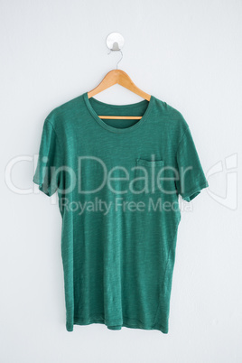 Green t-shirt on hanger
