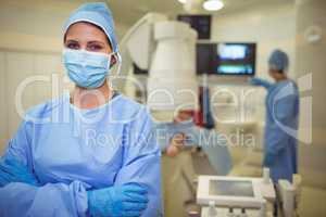 Portrait of female surgeon standing in operation theater