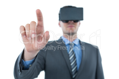 Businessman pointing his finger while using virtual reality headset