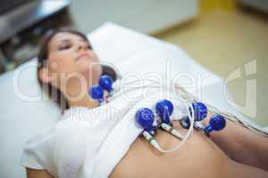 Female patient undergoing an electrocardiogram test