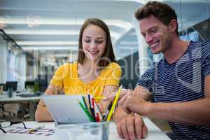 Graphic designers working at desk