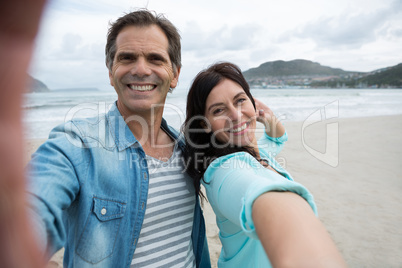 Portrait of couple enjoying on beach