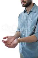 Cupped hands of man pretending to hold an invisible object