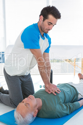 Paramedic performing resuscitation on patient