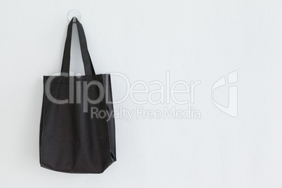 Black bag hanging on wall