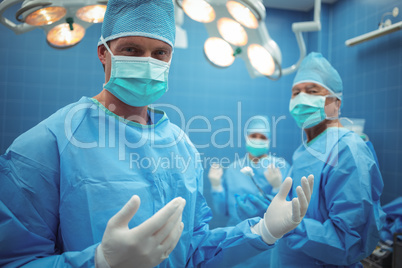 Portrait of male surgeon wearing surgical mask in operation theater