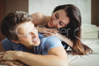 Romantic couple relaxing on bed