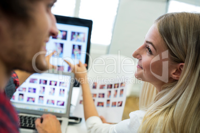 Graphic designers working over laptop