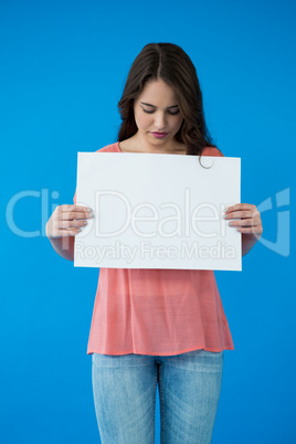 Woman holding a blank placard