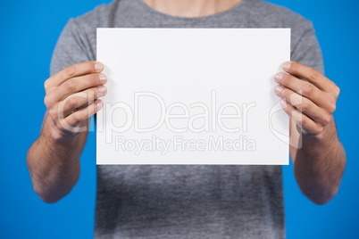 Man holding a blank placard