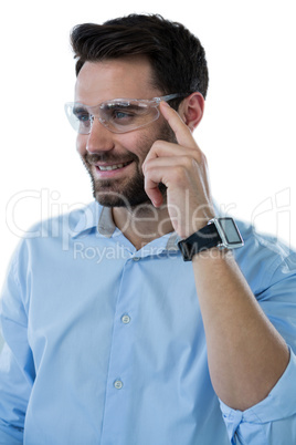 Man wearing protective eyewear and smart watch
