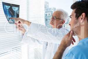 Surgeon and doctor discussing x-ray report