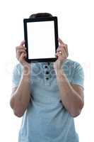 Man holding a digital tablet in front of his face