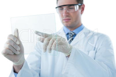 Male doctor using an futuristic digital tablet