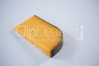 Piece of cheese on white background