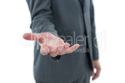 Mid section of businessman pretending to hold an object