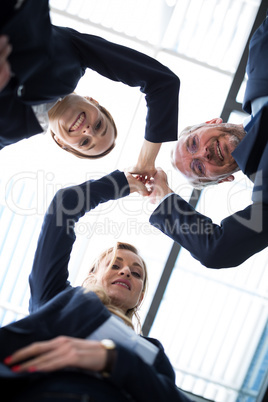 Happy businesspeople sharing high five