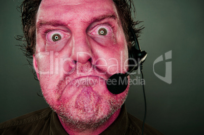 Grumpy Red Eyes and Face Customer Support Man with Headset
