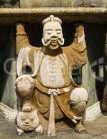 Statue of Man at Wat Pho in Bangkok, Thailand.