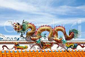 Colorful dragon statue on china temple roof.