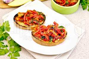 Bruschetta with vegetables in plate on table